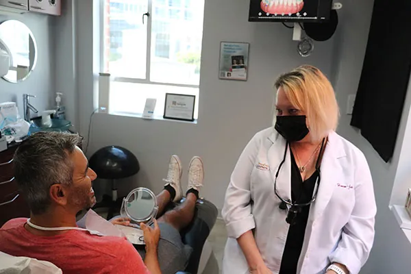 Dr. Hanam-Jahr discussing smile makeover options with her patient